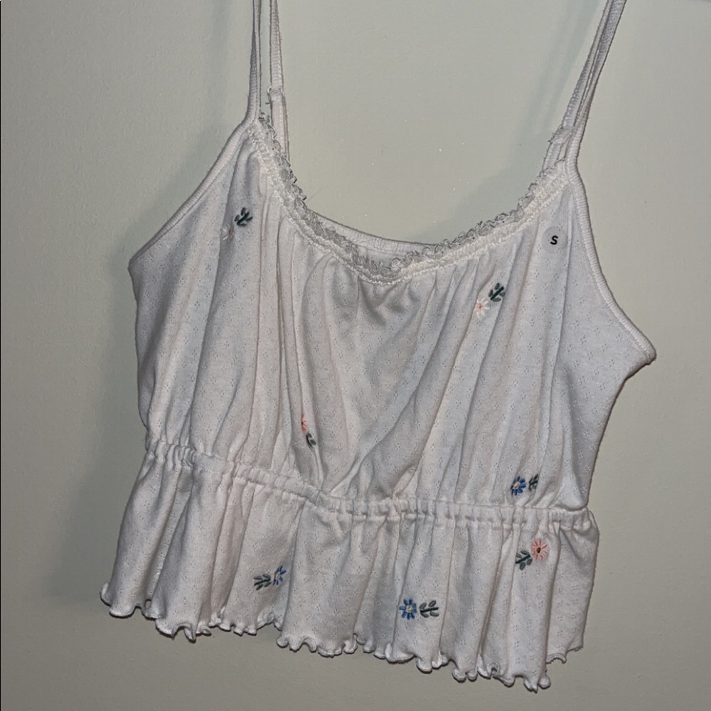 Both white and olive version of these small flower tank tops. - Picture 1 of 2